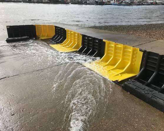 FloodFence lightweight diverting water runoff into a river