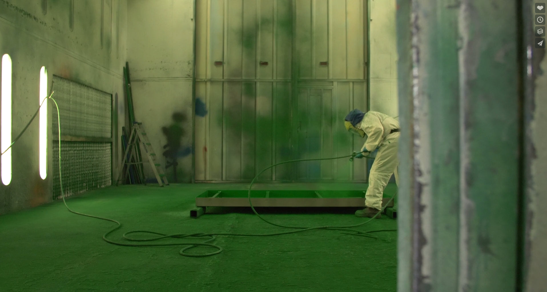 Spray painting inside the paint booth at Emtez UK