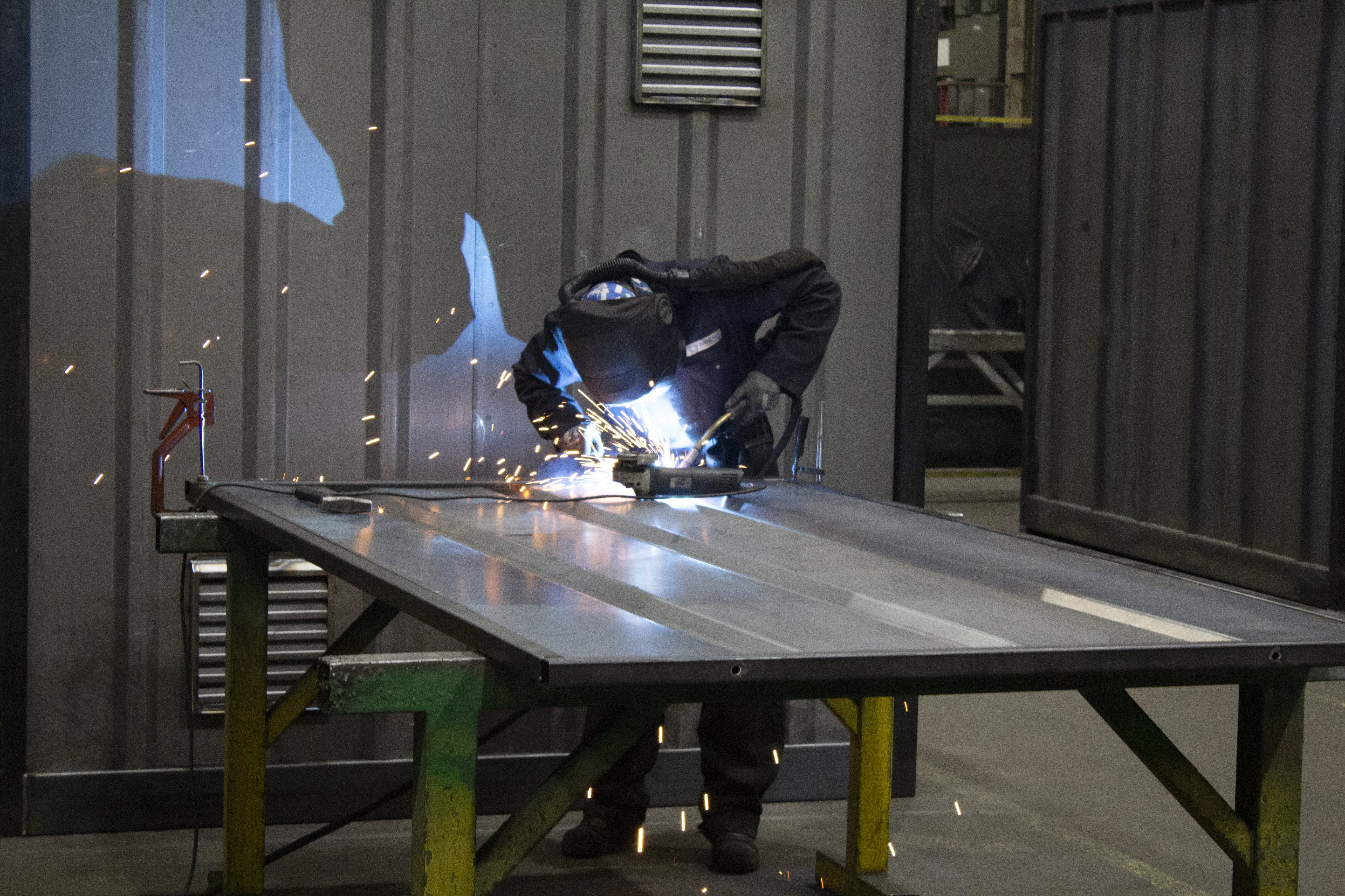Welder at Emtez UK working on a steel panel